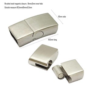 May include: Brushed silver magnetic clasp for jewelry making. The clasp measures 19.5 mm long, 10 mm wide, and has an 8 mm by 3 mm inner hole.