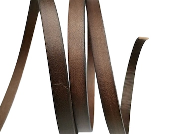 May include: A close-up of brown leather cord, showing the texture and color of the leather.