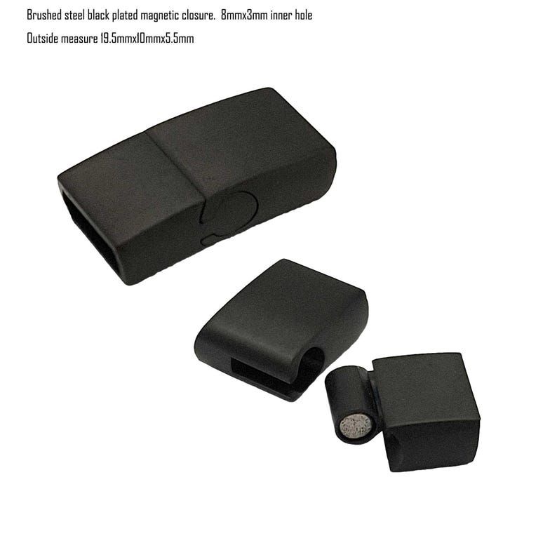 May include: Black magnetic clasp for jewelry or crafts. The clasp is made of brushed steel and has a rectangular shape. It measures 19.5mm x 10mm x 5.5mm and has an 8mm x 3mm inner hole.