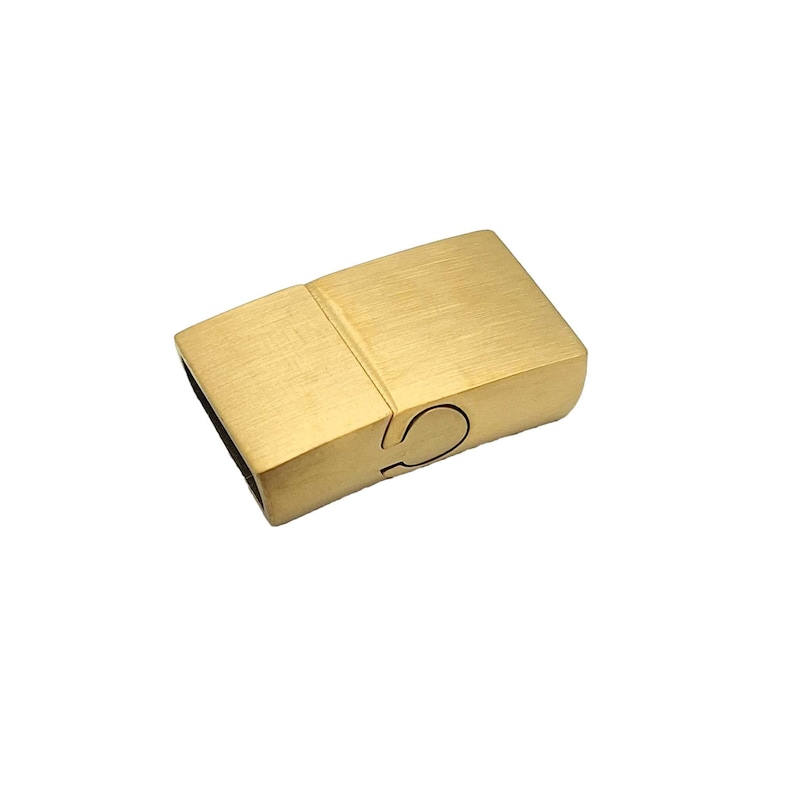 May include: Gold-toned magnetic clasp for jewelry making. The clasp is rectangular with a brushed finish.
