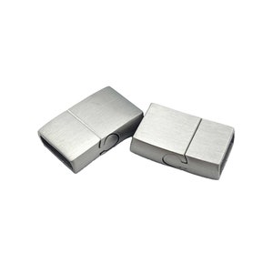 May include: Two silver magnetic clasps for jewelry making. The clasps are rectangular and have a brushed finish.