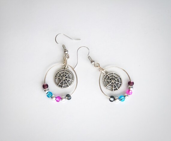 Swarovski spider web earrings discount