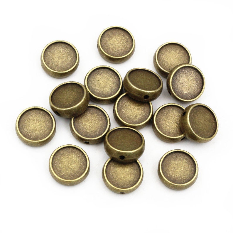 20 piezas 10mm 12mm tamaño interior bronce antiguo Color plata con agujero de 2mm rebordear cabujón Base camafeo ajuste en blanco para la fabricación de joyas DIY Bronze