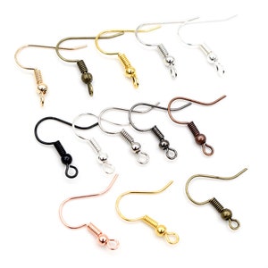May include: Assortment of earring hooks in various colors, including gold, silver, black, and rose gold. The hooks have a spring-loaded closure and are designed for jewelry making.