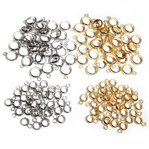 May include: A collection of gold and silver jump rings with two loops. The jump rings are perfect for jewelry making and crafting.