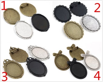 May include: Four sets of oval-shaped metal blanks for jewellery making. Each set includes two blanks, one with a silver finish and one with a bronze finish. The blanks have a decorative edge and a pin back.