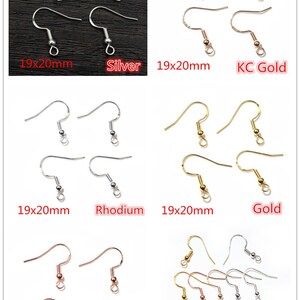 May include: Four sets of earring hooks in different finishes: silver, KC gold, rhodium, and rose gold. Each set includes four hooks, measuring 19x20mm. A fifth set includes a mix of all four finishes.