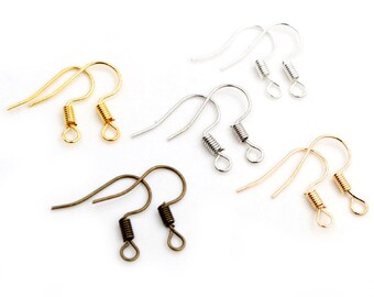 May include: A set of six earring hooks in three different colors: gold, silver, and bronze. Each hook has a spring closure.