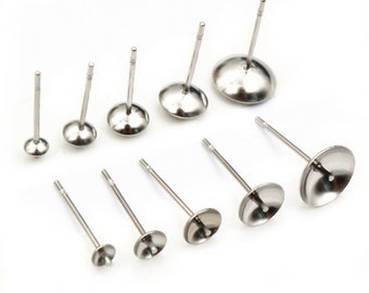 May include: A set of eight silver earring posts with different sized round bezels. The posts are made of stainless steel and are designed to hold small cabochons or other embellishments.