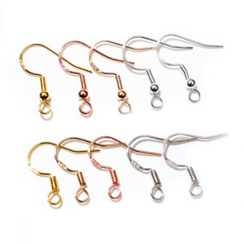 May include: A set of 10 earring hooks in three different finishes: gold, rose gold, and silver. The hooks are made of metal and have a spring-loaded closure.
