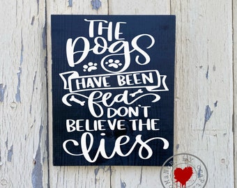 The Dogs Have Been Fed Don't Believe The Lies -  9 x 12 inch Painted Wood Sign With Paw Prints and Bones
