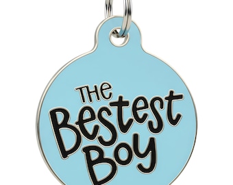 May include: A light blue pet tag with a silver ring. The tag is circular and features the words "The Bestest Boy" in black lettering.