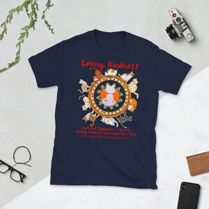 May include: Navy blue t-shirt with a graphic of a circle of cats surrounding a meditating cat. The text "Loving Kindness" is at the top of the circle. The text "pursuit Happiness + spread Loving Kindness one meow at a Time" is below the circle. The text "@lovingkindnessmeditationsociety" is at the bottom of the graphic.