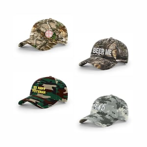May include: Four camouflage baseball caps. One has a target symbol, another says "BEER ME", a third says "US NAVY VETERAN", and the last has the number "345". The caps are in various shades of green, brown, and grey.