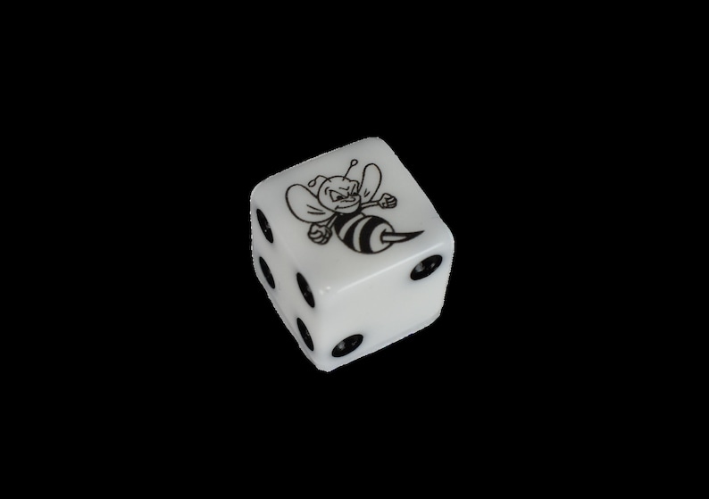 May include: White dice with black dots and a black and white bee illustration on one side.