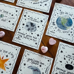 Negen afdrukbare valentijnskaarten met aquarel- en doodle-ruimtethema's voor kinderen en volwassenen