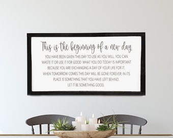 May include: A framed black and white sign with the text "This is the beginning of a new day. You have been given this day to use as you will. You can waste it or use it for good. What you do today is important because you are exchanging a day of your life for it. When tomorrow comes this day will be gone forever, in its place is something that you have left behind. Let it be something good."