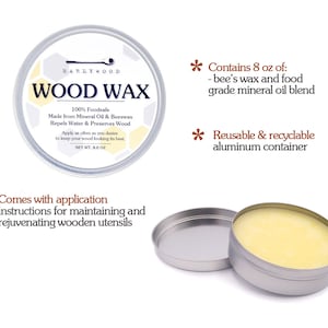 May include: A round, silver tin of Earlywood Wood Wax, with a label that reads "100% Foodsafe Made from Mineral Oil & Beeswax Repels Water & Preserves Wood" and "Net Wt. 8 oz". The tin is open, revealing a yellow wax inside. The tin is sitting on a white surface. The text "Contains 8 oz of: - bee's wax and food grade mineral oil blend" and "Reusable & recyclable aluminum container" is written in brown text on a white background. The text "Comes with application instructions for maintaining and rejuvenating wooden utensils" is written in brown text on a white background.