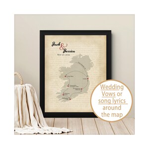 May include: A framed map of Ireland on a beige background featuring the names Jack and Jessica, the date May 20, 2023, and a dotted path connecting various locations marked with red hearts, overlaid with faint text.