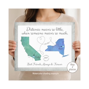 May include: A framed print featuring a green California map and a blue New York map connected by a dashed heart line. Text reads: Distance means so little, when someone means so much. Best Friends, Always & Forever. Includes 1,847 Miles, Emily, Megan, and Friendship Established 2007.