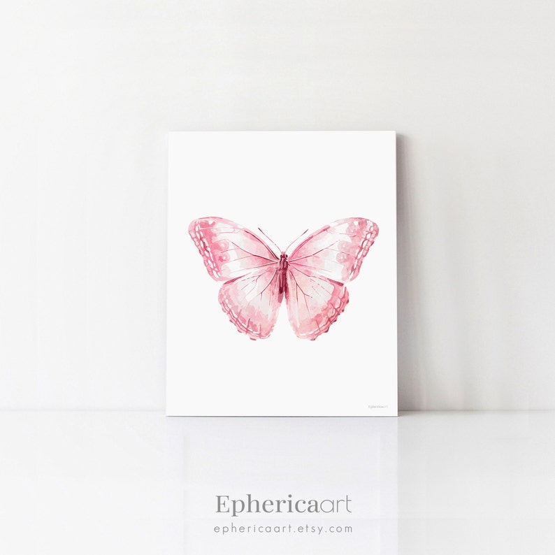 May include: A pink watercolor painting of a butterfly with detailed wing patterns. The artwork is displayed on a white background. The artist's name, "Ephericaart", and their Etsy shop URL are printed at the bottom.