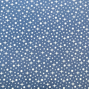 May include: A blue fabric with a white polka dot and star pattern.
