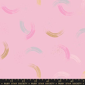 May include: Pink fabric with a repeating pattern of gold, pink, and blue brushstrokes in the shape of arcs. The fabric has a subtle sparkle.