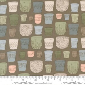 May include: Fabric with a repeating pattern of various sized, illustrated flower pots in shades of green, blue, peach, and white on a brown background. Some pots have floral or geometric designs. The fabric is from Moda Fabrics.
