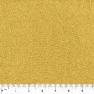 May include: Close-up of a golden yellow fabric with a subtle textured appearance. The fabric is measured with an inch ruler along the bottom edge, showing a scale from 0 to 6 inches.