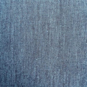 May include: Close-up of a textured, blue fabric. The material has a woven appearance with a subtle pattern of tiny, interwoven threads. The color is a solid, medium blue, with slight variations in tone.