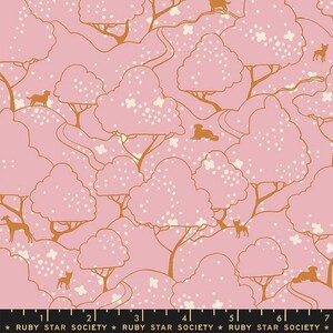 May include: A pink and brown fabric with a repeating pattern of trees, hills, and small dogs. The trees have white flowers and the hills are brown. The dogs are brown and are in various poses. The fabric has a white polka dot pattern.