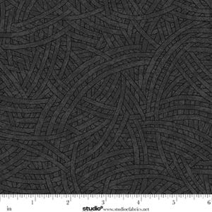 May include: A dark gray fabric featuring a repeating pattern of intersecting curved lines that create a woven, grid-like effect. A ruler at the bottom shows measurements in inches, with the text studio www.studioefabrics.net printed below.