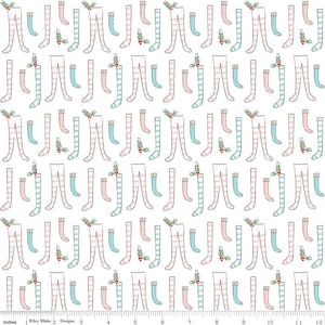 May include: White fabric with a repeating pattern of pink and blue striped stockings with a small sprig of holly at the top of each stocking.