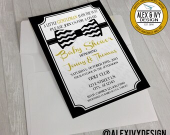 May include: Black and gold baby shower invitation with a bow tie design. The invitation reads "A little gentleman is on the way. Please join us for a co-ed baby shower honoring Jenny & Thomas. Saturday, October 19th, 2015. Four o'clock in the afternoon. Golf Club. 123 E Street Ln. City, AZ 12345. RSVP: Carmen 123.456.7890. Registered at Babies-R-Us & Target."