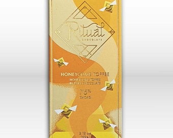 May include: A yellow and white chocolate bar wrapper with the text "Ritual Chocolate" and "Honeycomb Toffee" in gold lettering. The wrapper also features a honeycomb design and the text "75% Cacao" and "2.12 oz (60g)".