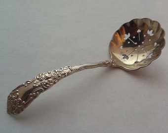 filet violon model and C C stamp. Christofle antique sugar sifting  fruit spoon with pretty pierced work spoon and silver plated handle