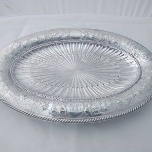 Beautiful rare heavy silver plated meat / fish / bread platter with embossed floral design