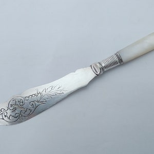 Decorative Antique silver plated butter spreader with mother of pearl handle