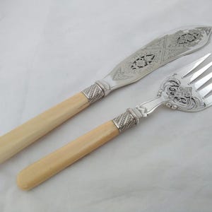 Decorative Antique silver plated pierced fish servers with natural handles