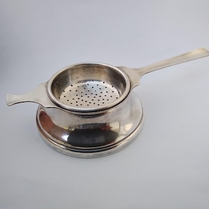 Vintage Art Deco silver plated tea strainer with stand