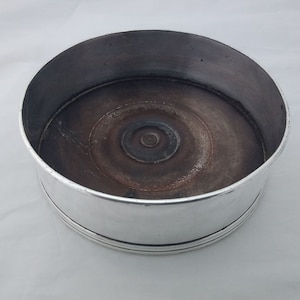 Vintage silver plated on copper wine bottle coaster with turned wooden base