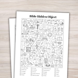 May include: Black and white Bible Hidden Object activity sheet. The sheet features a detailed illustration with various biblical scenes and objects. A checklist at the bottom helps identify items like an open bible, Noah's ark, and a cross.