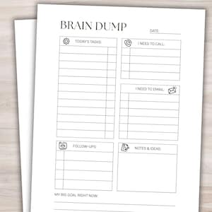 May include: A white Brain Dump notepad with sections for tasks, calls, emails, follow-ups, and notes. The notepad includes the text "BRAIN DUMP" at the top, with sections labeled "TODAY'S TASKS", "I NEED TO CALL", "I NEED TO EMAIL", "FOLLOW-UPS", and "NOTES & IDEAS".