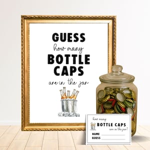 May include: A framed sign with the text "GUESS how many BOTTLE CAPS are in the jar". A glass jar filled with bottle caps sits next to the sign, along with a small card with fill-in-the-blank prompts.