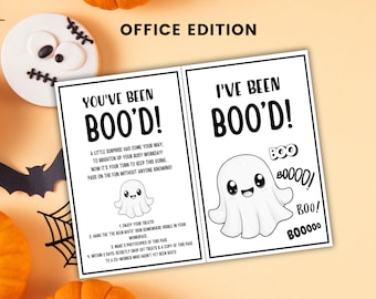 May include: A printable card titled OFFICE EDITION featuring the text YOU'VE BEEN BOO'D! and I'VE BEEN BOO'D! with instructions for a workplace game. The design includes black text, a small ghost illustration, and the word BOO repeated.