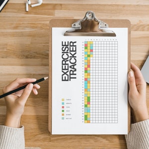 May include: A white clipboard with a black and white exercise tracker chart. The chart has a grid with days of the week and numbers 1-31. The chart is colour-coded for different types of exercise: cardio, weights, yoga, aqua, boxing, and rest day.