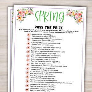 May include: A printed game sheet titled "Spring Pass the Prize" with floral accents. The game includes instructions and prompts for passing a prize based on various criteria, perfect for a spring gathering or party.