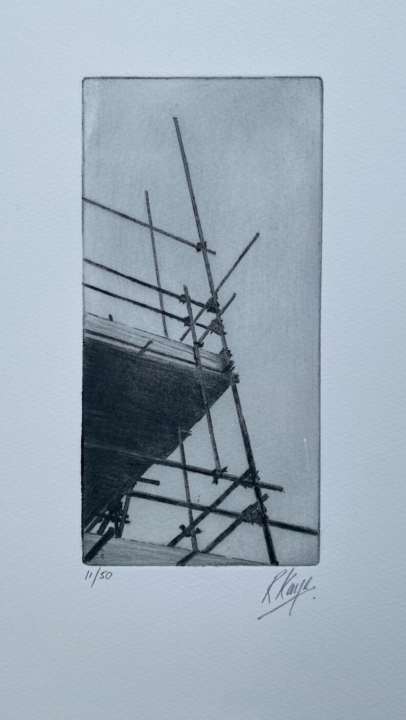 May include: A black and white etching of a scaffolding structure, with the number "11/50" and the artist's signature "R Kaye" in the bottom corner.