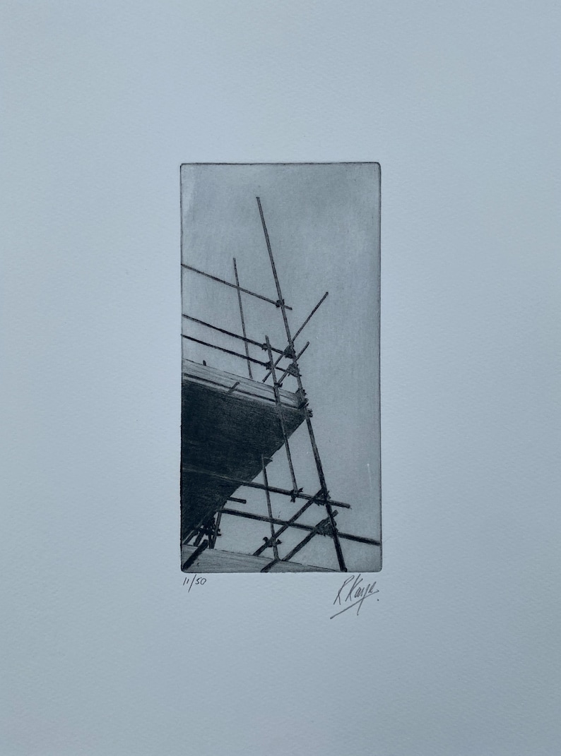 This is a scaffolding print featuring a bold silhouette of some scaffolding on a building. It's very unusual and striking, due to the composition and unexpected subject matrter.