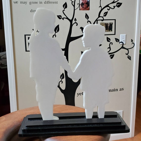 Boy and Girl Silhouette Statue